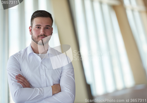 Image of business man with beard at modern office