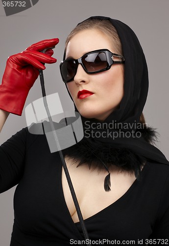 Image of lady in red gloves with crop