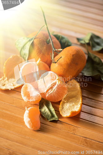 Image of Ripe tangerines on wooden