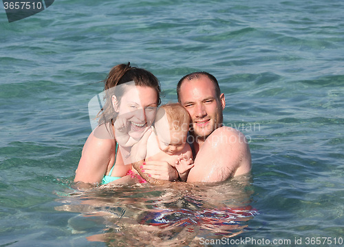 Image of Family enjoying in the sea