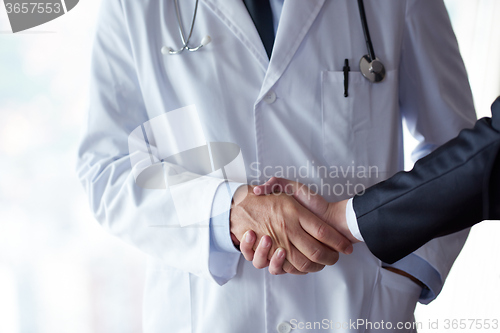 Image of doctor handshake with a patient