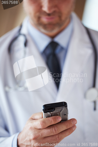 Image of doctor speaking on cellphone