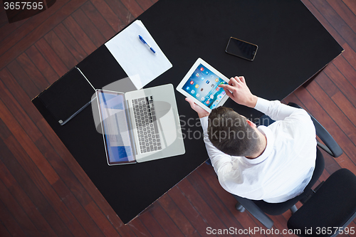 Image of top view of young business man at office