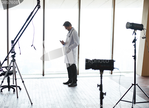 Image of doctor speaking on cellphone