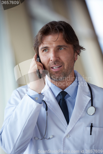 Image of doctor speaking on cellphone