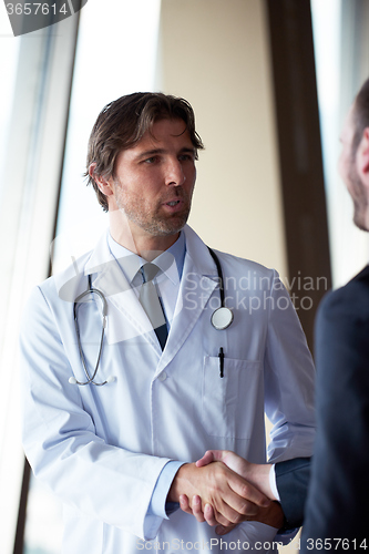 Image of doctor handshake with a patient