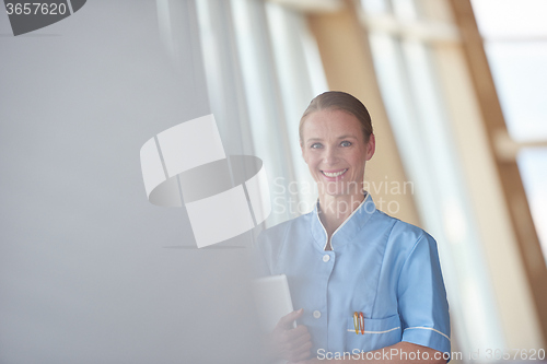 Image of female doctor with tablet computer