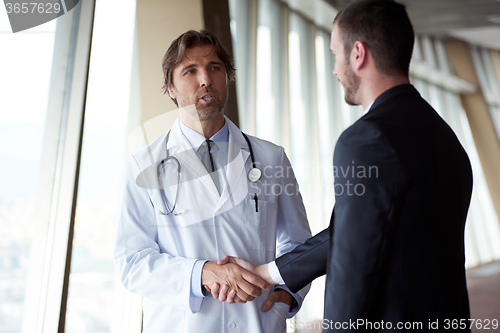 Image of doctor handshake with a patient