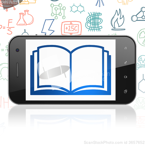 Image of Science concept: Smartphone with Book on display