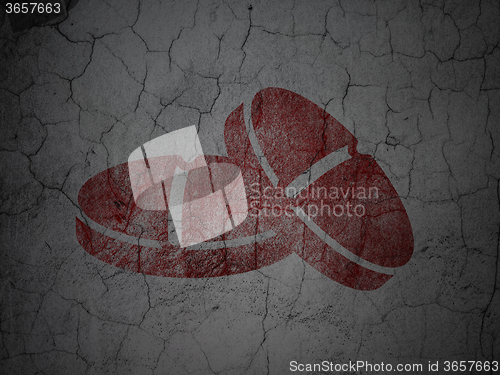 Image of Medicine concept: Pills on grunge wall background