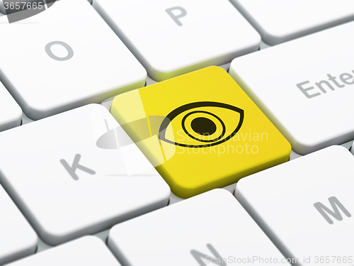Image of Safety concept: Eye on computer keyboard background