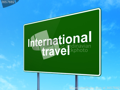 Image of Vacation concept: International Travel on road sign background