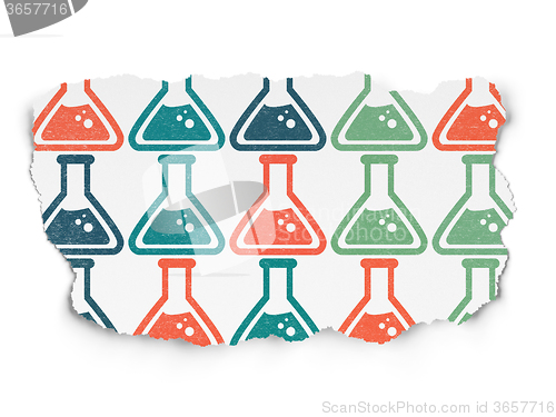 Image of Science concept: Flask icons on Torn Paper background