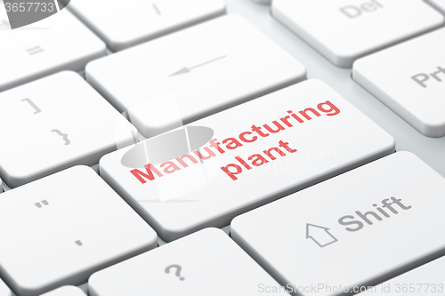 Image of Manufacuring concept: Manufacturing Plant on computer keyboard background