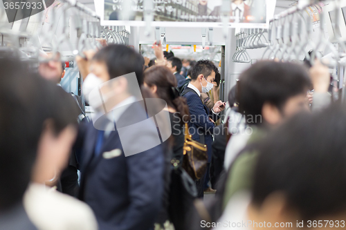 Image of Passengers traveling by Tokyo metro.