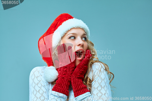 Image of portrait of girl dressed in santa hat 