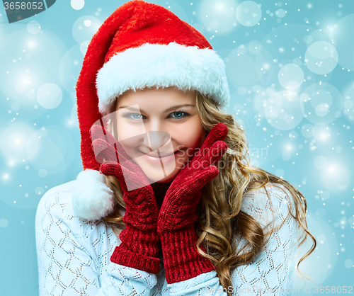Image of portrait of girl dressed in santa hat 