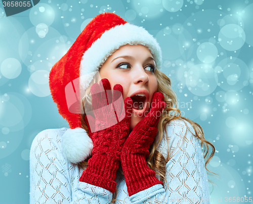 Image of portrait of girl dressed in santa hat 