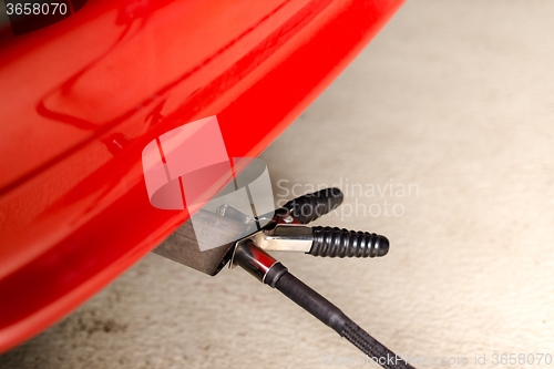 Image of Measuring exhausts of a car in garage