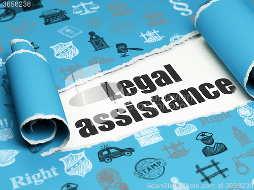 Image of Law concept: black text Legal Assistance under the piece of  torn paper