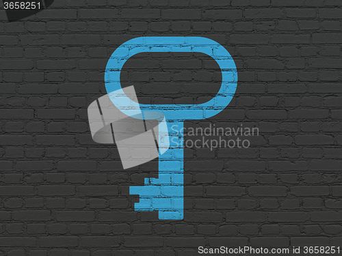 Image of Protection concept: Key on wall background