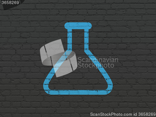 Image of Science concept: Flask on wall background