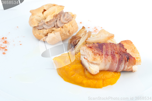 Image of Typical Italian appetizer with liver pate and bacon