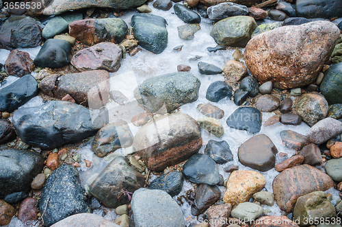 Image of The freezed stones on coast of Baltic sea. A winter landscape