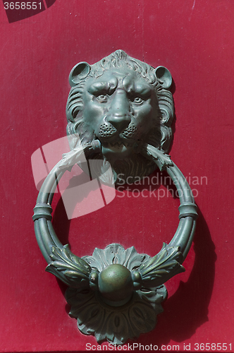 Image of Detail of an old iron handle in the shape of lion