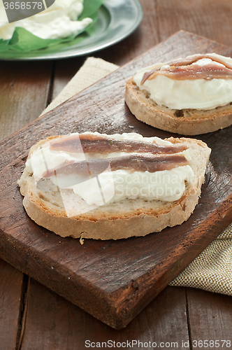 Image of Italian bruschetta with bread calabrese, burrata cheese and anch