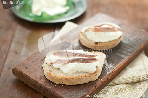 Image of Italian bruschetta with bread calabrese, burrata cheese and anch