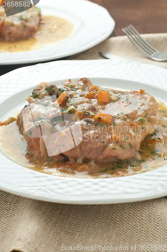 Image of 
marrowbone, veal cut used in Italian cooking with yellow risott