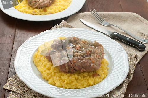 Image of 
marrowbone, veal cut used in Italian cooking with yellow risott