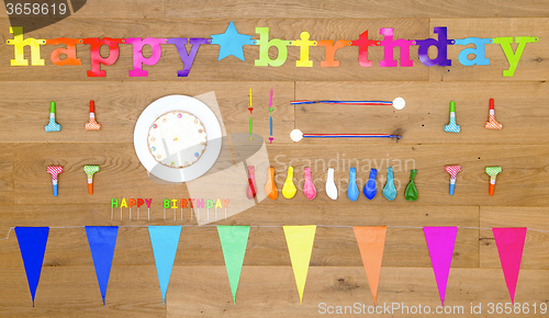 Image of Birthday background items on wooden floor board