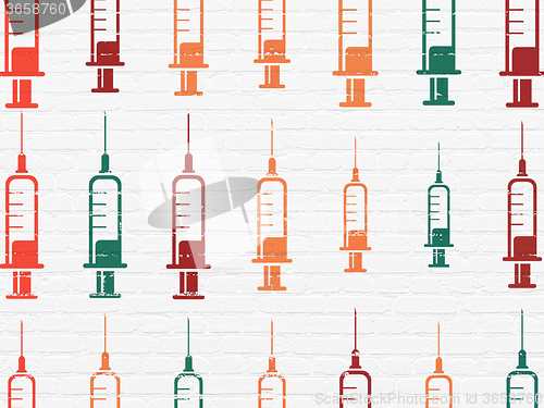 Image of Health concept: Syringe icons on wall background