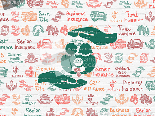 Image of Insurance concept: Family And Palm on wall background