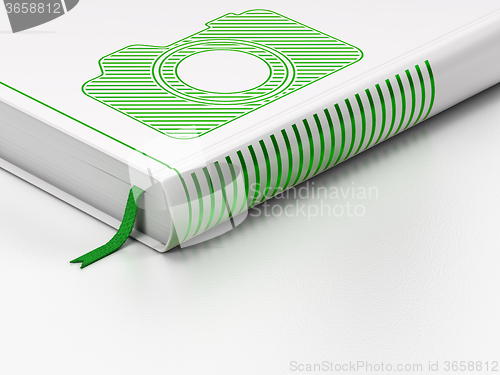 Image of Tourism concept: closed book, Photo Camera on white background