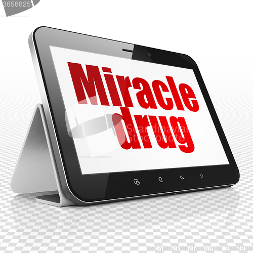 Image of Healthcare concept: Tablet Computer with Miracle Drug on display