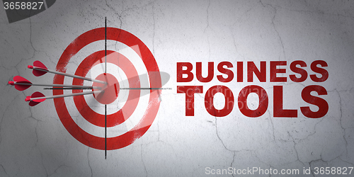 Image of Finance concept: target and Business Tools on wall background