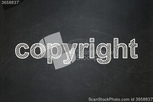 Image of Law concept: Copyright on chalkboard background