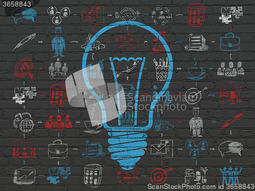 Image of Finance concept: Light Bulb on wall background