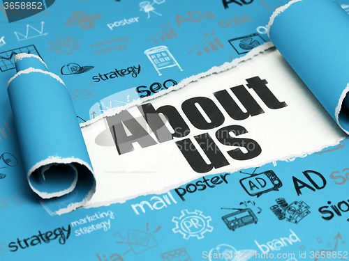 Image of Advertising concept: black text About Us under the piece of  torn paper