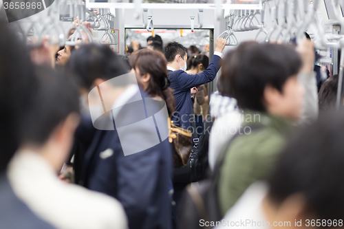 Image of Passengers traveling by Tokyo metro.