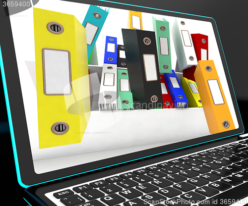 Image of Falling Files On Laptop Showing Unorganized