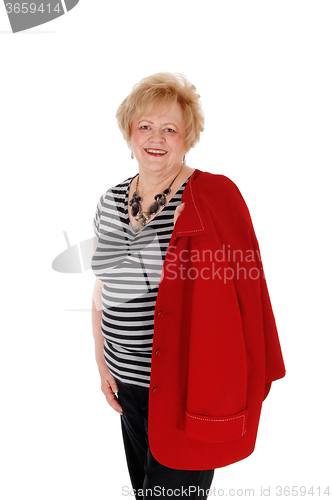 Image of Smiling older woman standing.