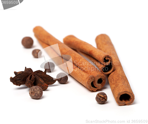 Image of Black peppercorns, anise stars and cinnamon sticks