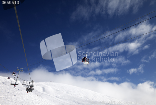 Image of Gondola and chair-lifts at ski resort in nice day