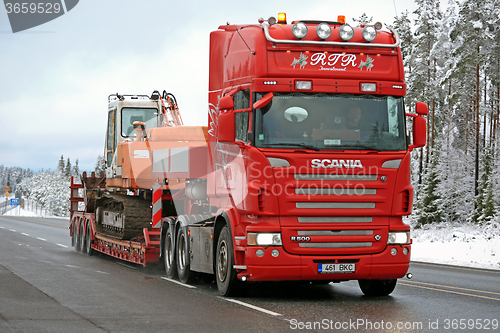 Image of Red Scania R500 Hauls Daewoo Excavator on Winter Road