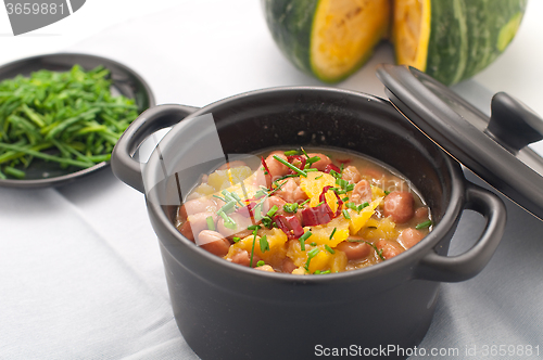 Image of 
Soup with beans and squash with chilli powder