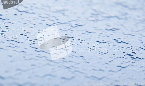Image of Connected blue puzzle pieces isolated
